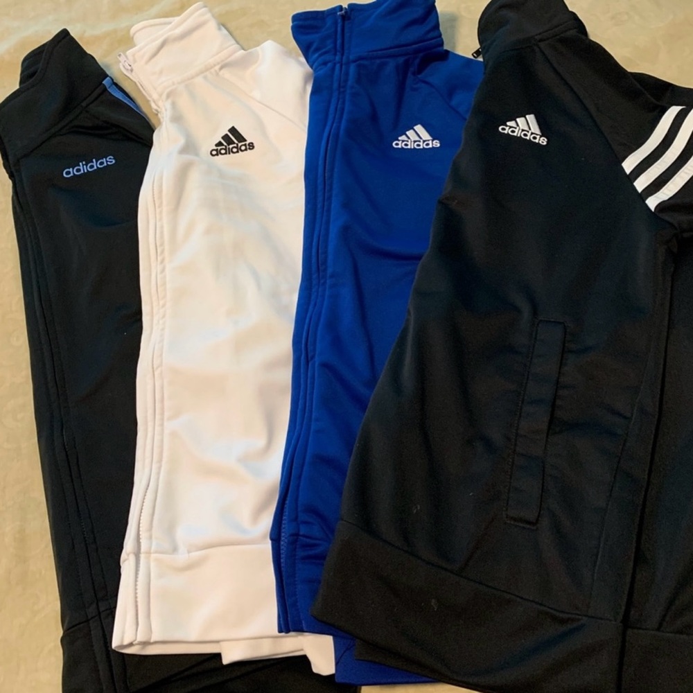 4 sweatshirts in good condition only white one has a stain